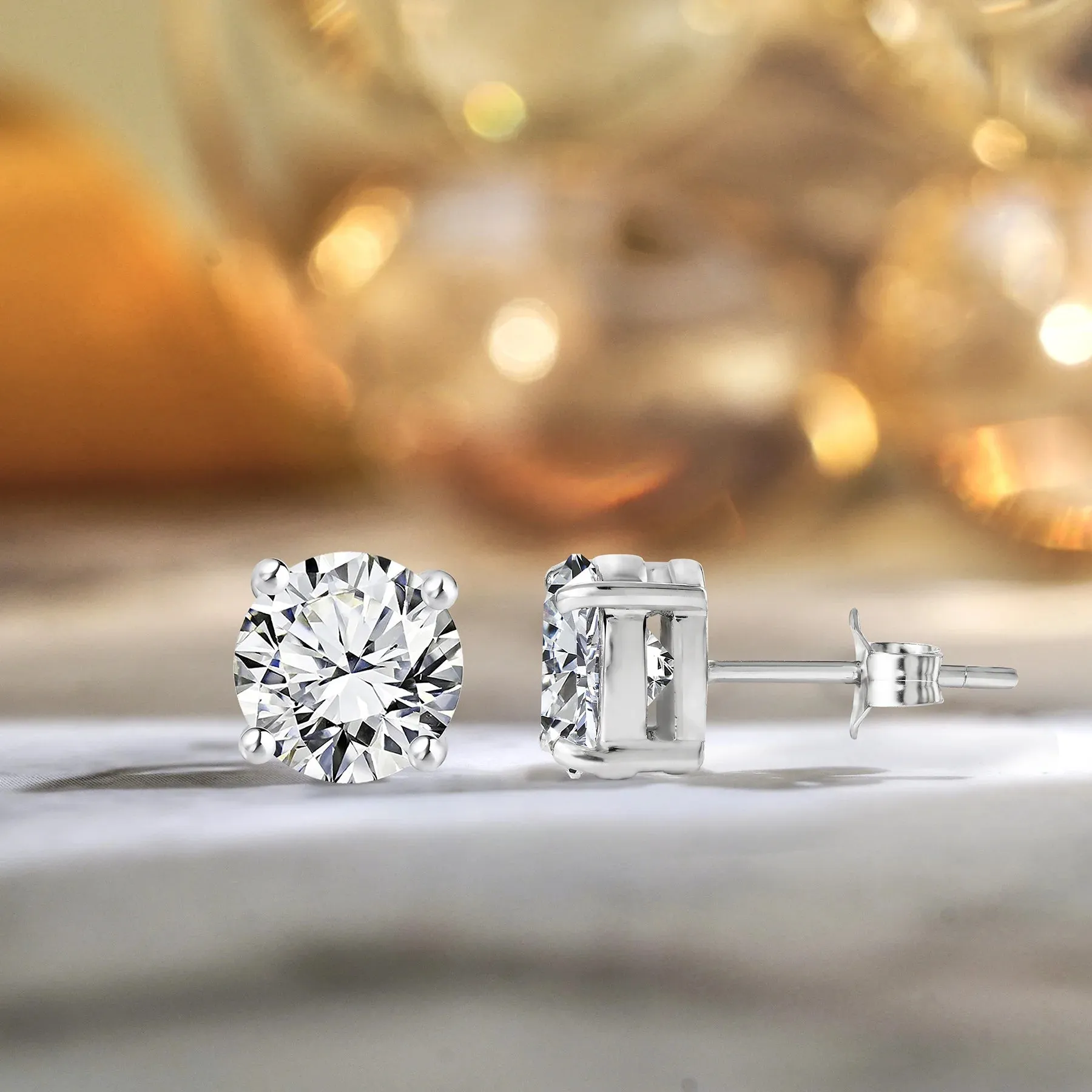 JeenMata 4 Prong 2 Carat Round Shaped Moissanite Solitaire Stud Earrings In 18K White Gold Plating Over Silver