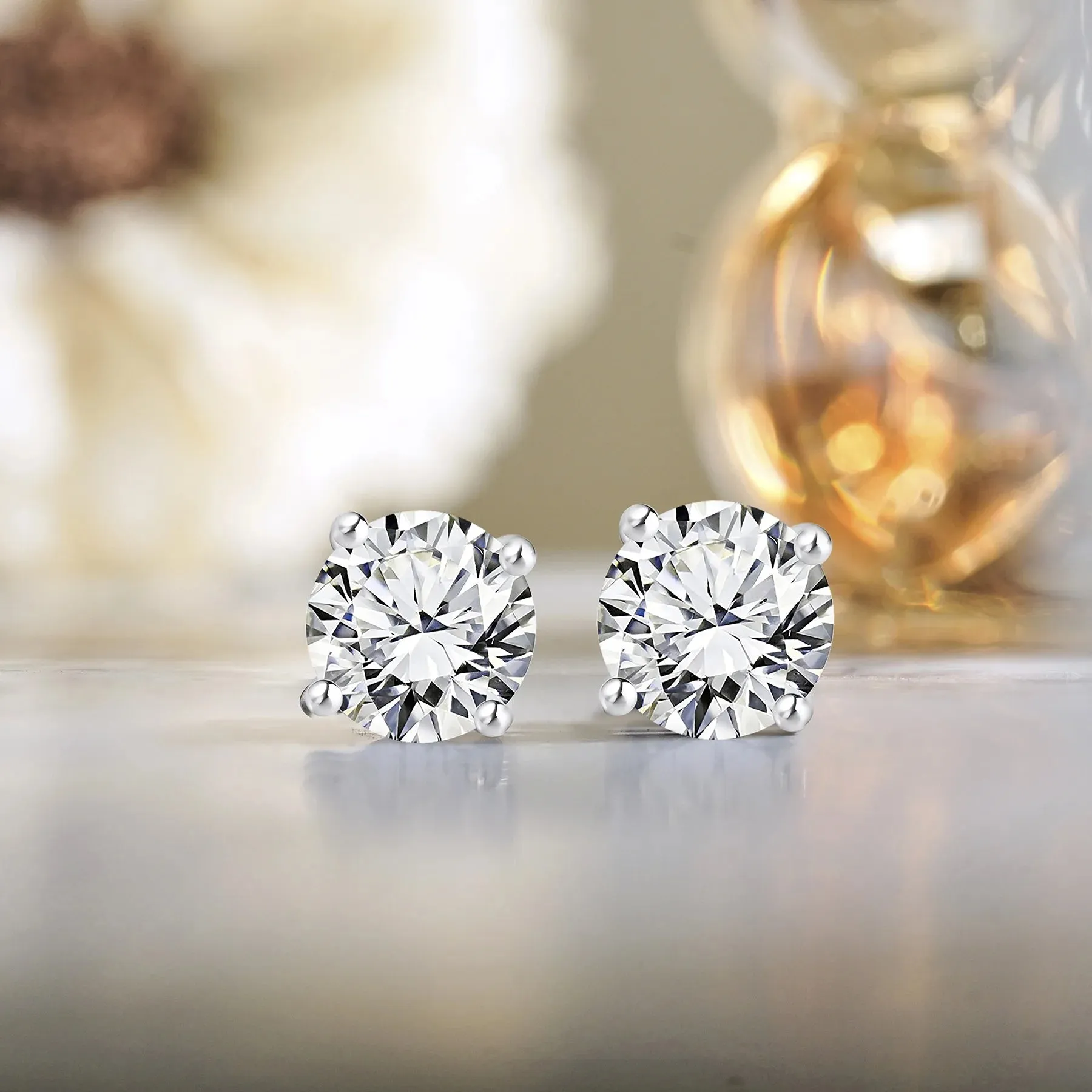 JeenMata 4 Prong 2 Carat Round Shaped Moissanite Solitaire Stud Earrings In 18K White Gold Plating Over Silver